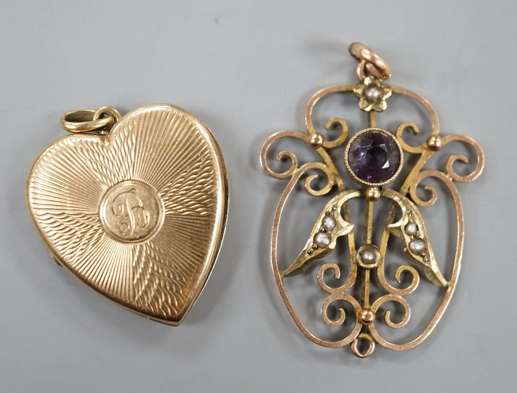 A 9ct gold heart shaped locket, with engraved inscription, 22mm and an Edwardian 9ct, amethyst and seed pearl set pendant